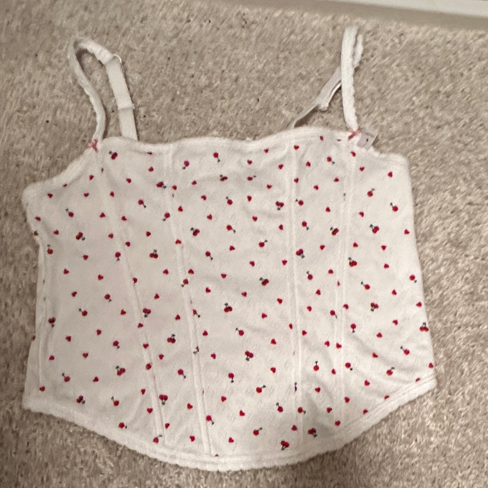 White Top with Red Floral Accents